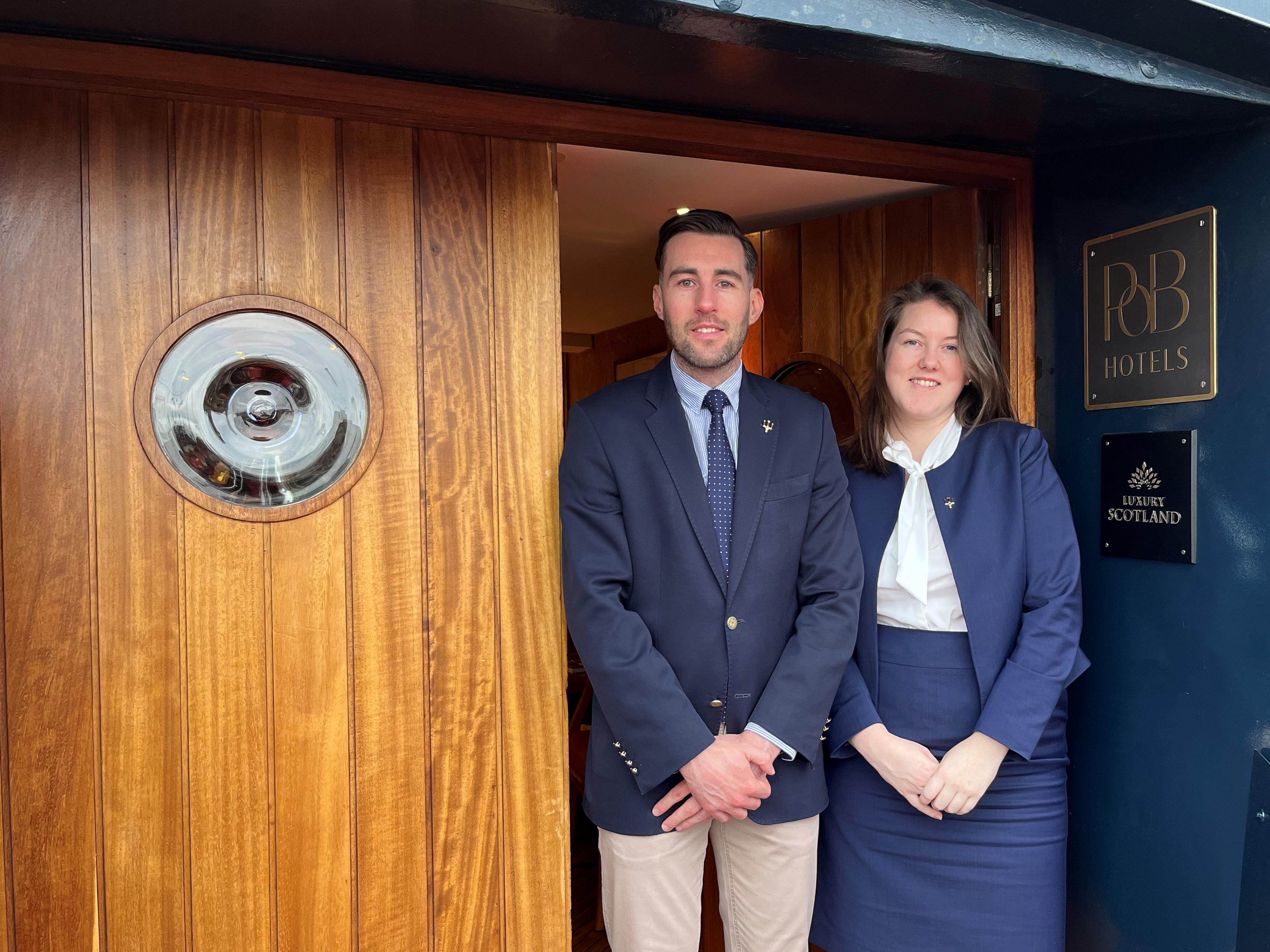 Morven and Anthony stand at the door to Fingal.
