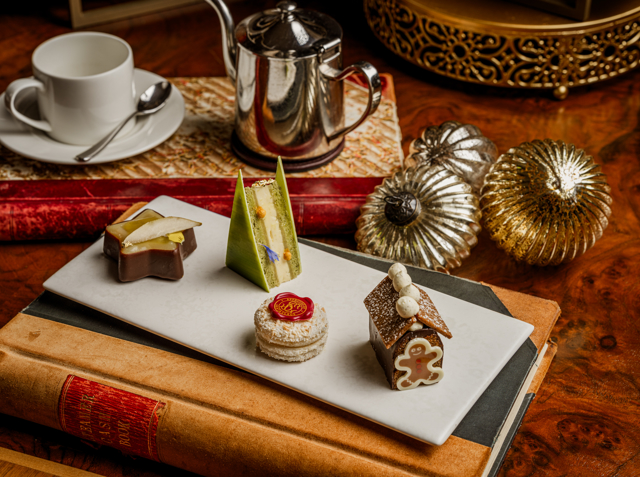 Festive afternoon tea selection aboard Fingal in Edinburgh at Christmas, featuring seasonal pastries and elegant miniature desserts
